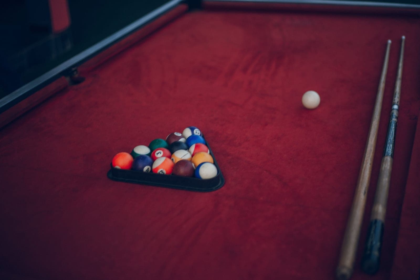 Racked balls on a home billiard table before the break